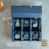 Blue watch storage case with six compartments, labeled features on a gray background