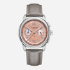 A LERIN watch featuring a round silver stainless steel case, a peach-pink dial with Roman numerals and two sub-dials, and a textured light gray leather strap, shown against a light gray background.